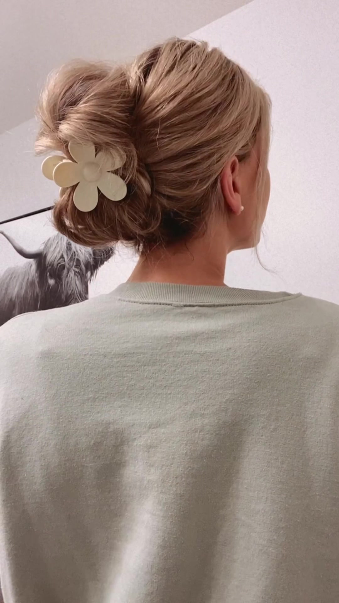 TikTok screenshot of a simple claw clip hairstyle by @maceylarose.